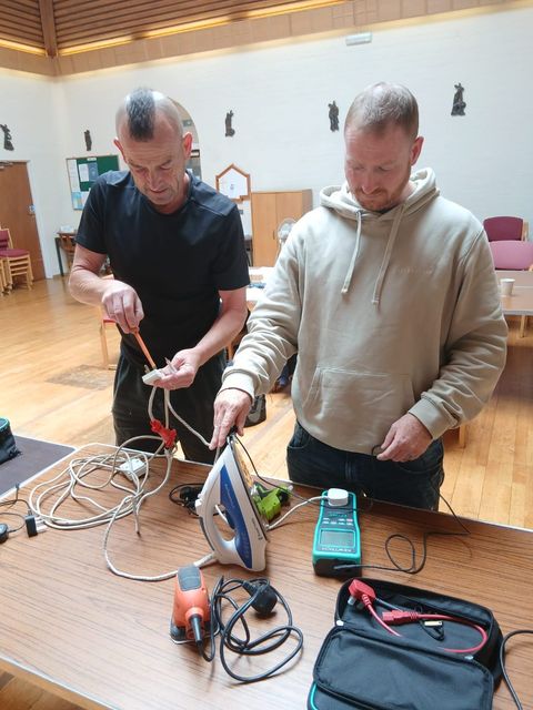 Learners inspecting an appliance together